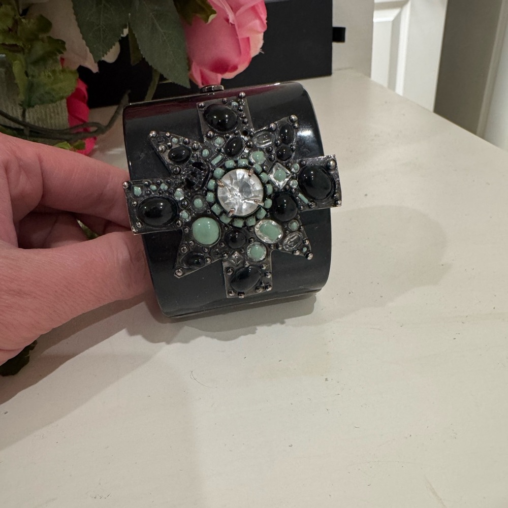 Chanel cuff ( the black paint of the central gem and cc on top are missing)